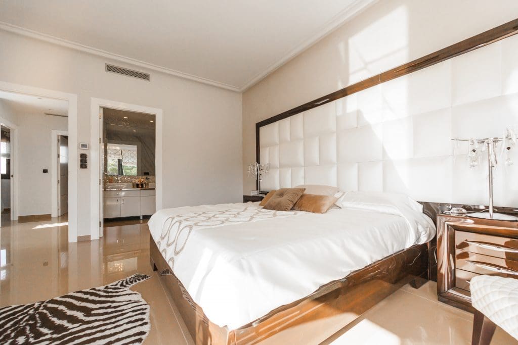 Selling Your Home Part 3: The Etiquette to Follow for Showings 19 modern bedroom with zebra carpet and king-sized bed with fresh, white linen