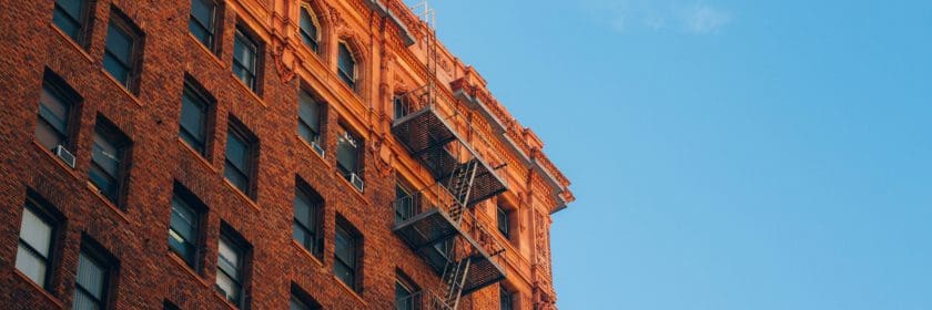 Street view of old brick apartment unit