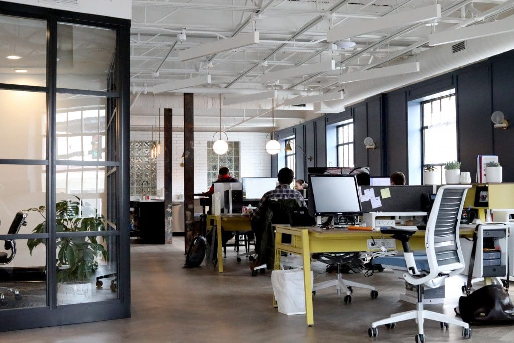 How to Prepare for An Office Move 3 Desks and work stations at a modern office.