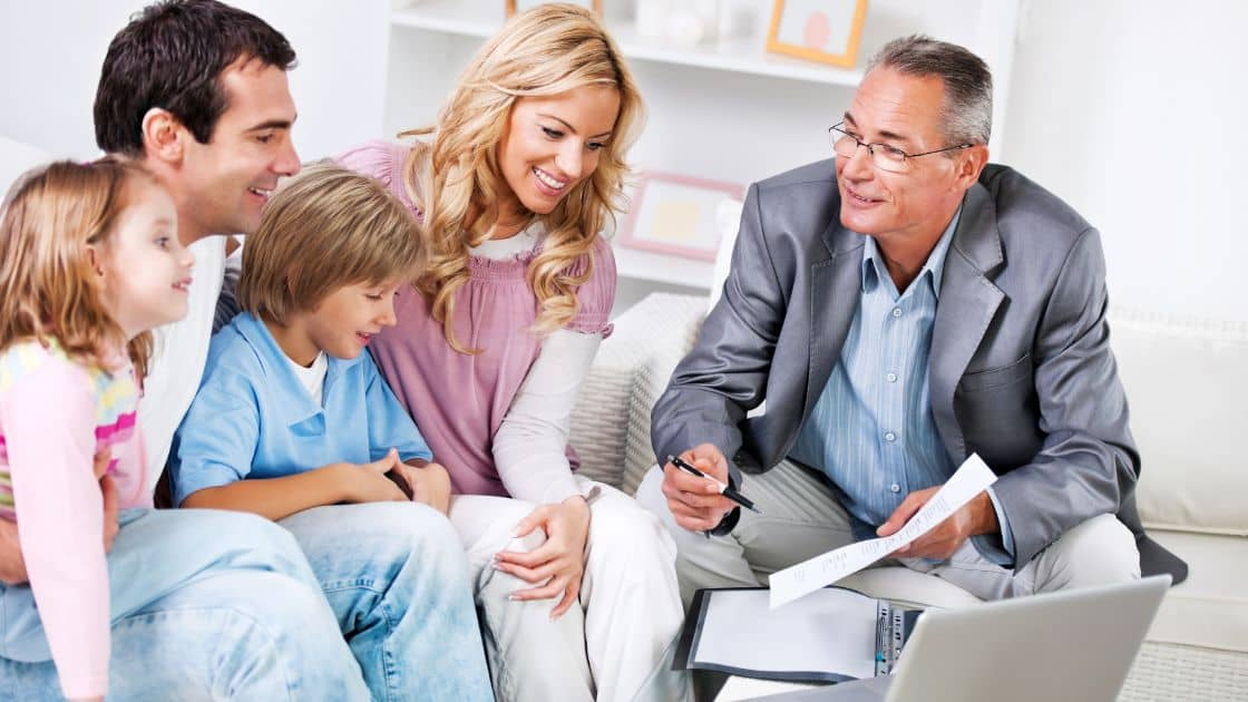 A family discussing their home insurance policy with an insurance provider