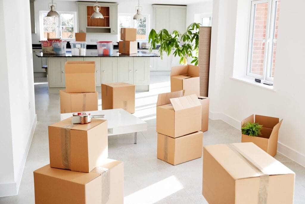 The Moving Mistakes I See Most Often in Barrhaven and Orleans — and How I Help Families Avoid Them 16 stacked removal boxes in empty room on moving day RMYEDG3